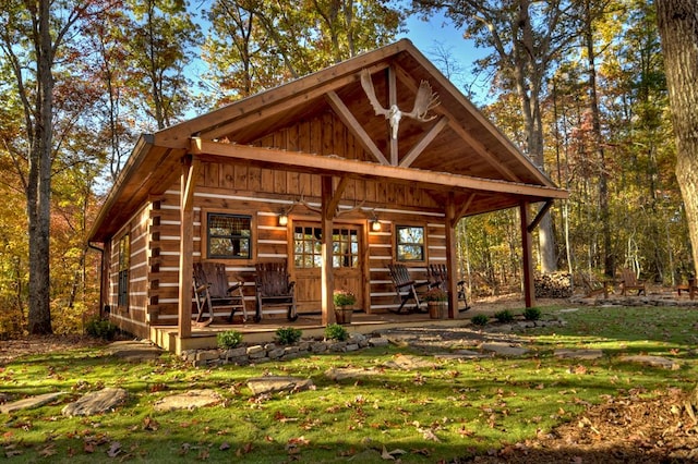 exterior space featuring a yard and covered porch