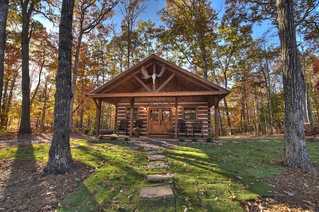 exterior space featuring a yard and covered porch