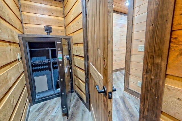 interior space featuring hardwood / wood-style flooring and wooden walls