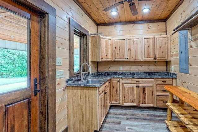 kitchen with wood ceiling, plenty of natural light, sink, and dark hardwood / wood-style flooring