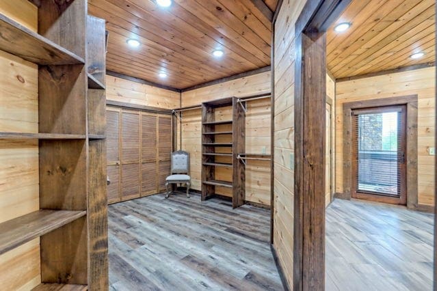 walk in closet featuring hardwood / wood-style flooring