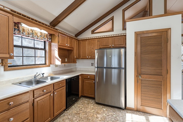 kitchen with a textured ceiling, sink, lofted ceiling with beams, black dishwasher, and stainless steel refrigerator