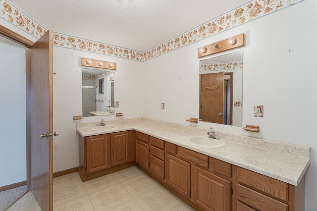 bathroom featuring vanity and a textured ceiling