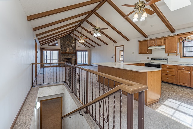 kitchen with a kitchen bar, plenty of natural light, white electric range oven, and beam ceiling