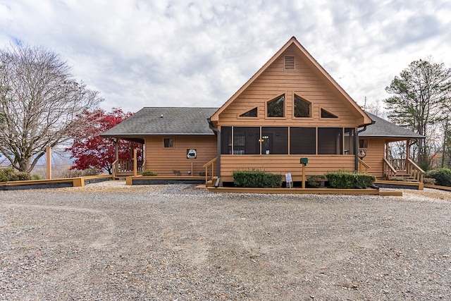 view of front of home with a sunroom