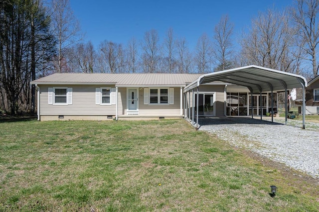 view of front of home featuring driveway, crawl space, metal roof, and a front yard