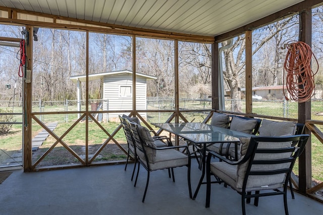 sunroom with outdoor dining space
