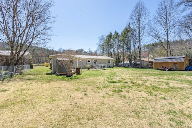view of yard with a storage unit and an outdoor structure