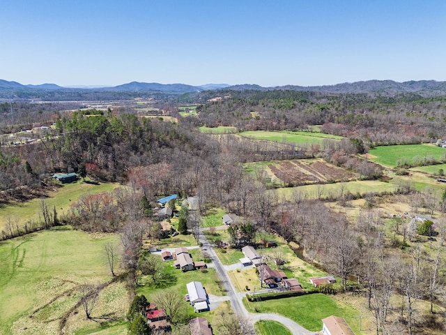 aerial view of property's location featuring mountains