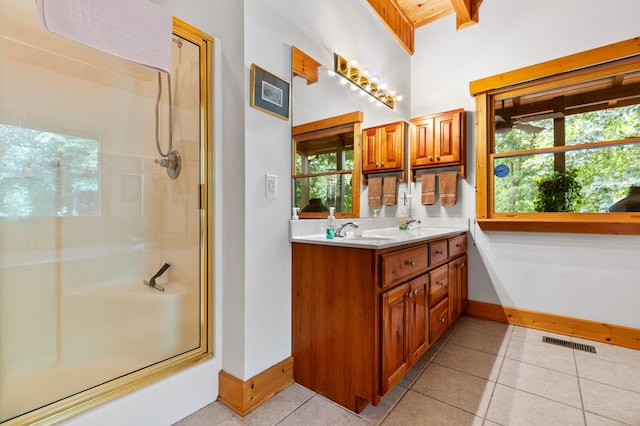 bathroom with tile patterned flooring and vanity