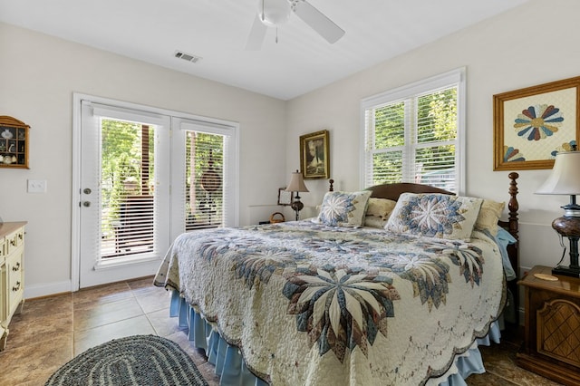 tiled bedroom with ceiling fan, multiple windows, and access to outside