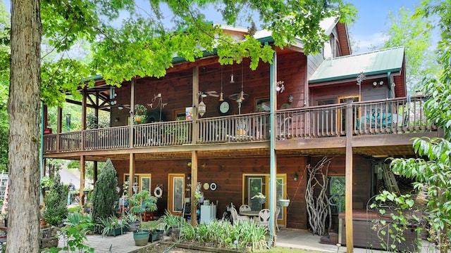 back of house featuring a deck