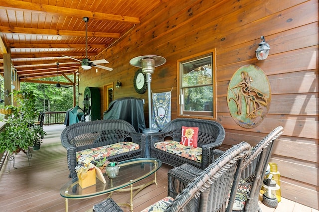 wooden deck with ceiling fan and covered porch