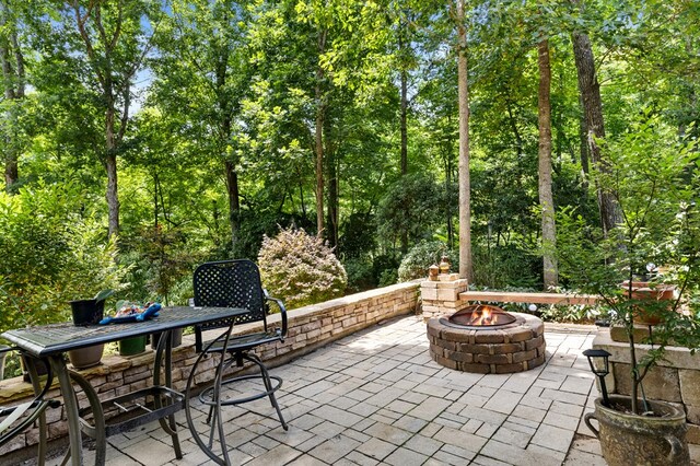 view of patio with a fire pit