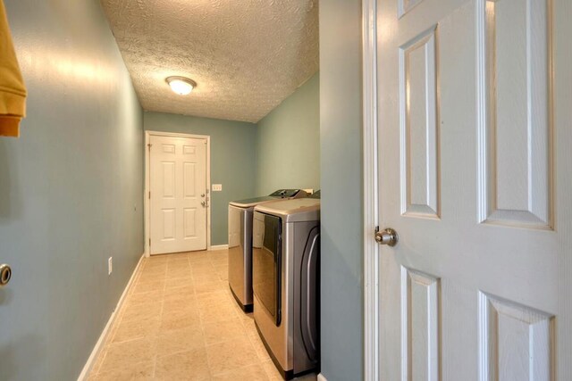35 Deer Run Rd, Blairsville, GA 30512 - washroom with washer and dryer, a textured ceiling, baseboards, and light tile patterned floors