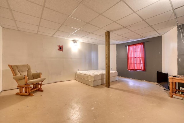 basement featuring a drop ceiling