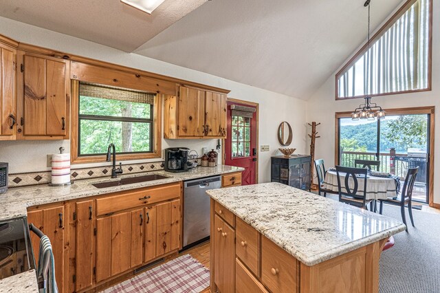 40 White Cloud Dr, Murphy, NC 28906 - kitchen with dishwasher, electric range, vaulted ceiling, a center island, and brown cabinets