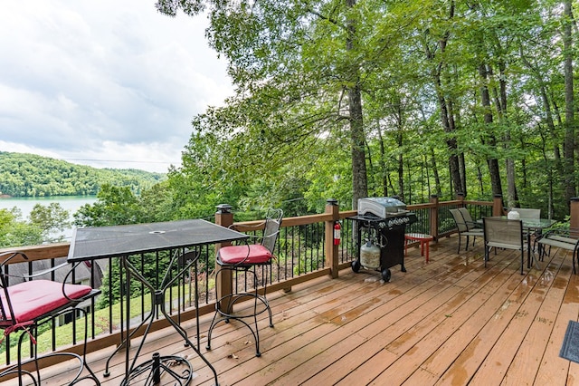 40 White Cloud Dr, Murphy, NC 28906 - wooden terrace featuring outdoor dining area, area for grilling, a view of trees, and a water view