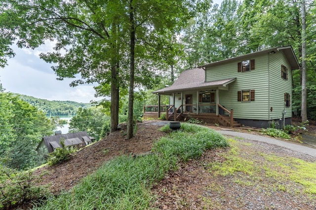 40 White Cloud Dr, Murphy, NC 28906 - view of front of house featuring crawl space, covered porch, and a view of trees