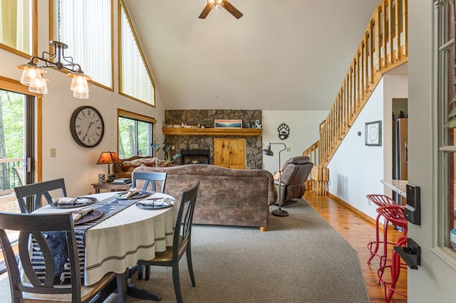 40 White Cloud Dr, Murphy, NC 28906 - dining space with plenty of natural light, a ceiling fan, wood finished floors, and high vaulted ceiling