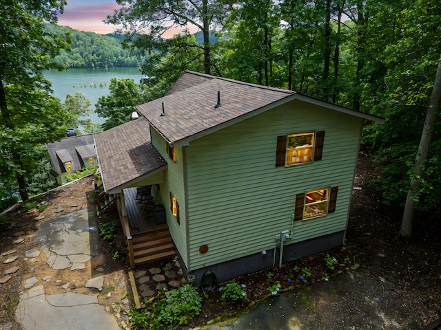 40 White Cloud Dr, Murphy, NC 28906 - view of property exterior with a shingled roof and a deck with water view