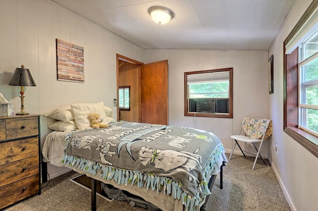 bedroom with cooling unit and carpet floors