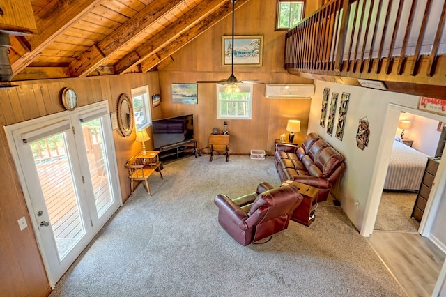 carpeted living room featuring beam ceiling, wood ceiling, wooden walls, and an AC wall unit