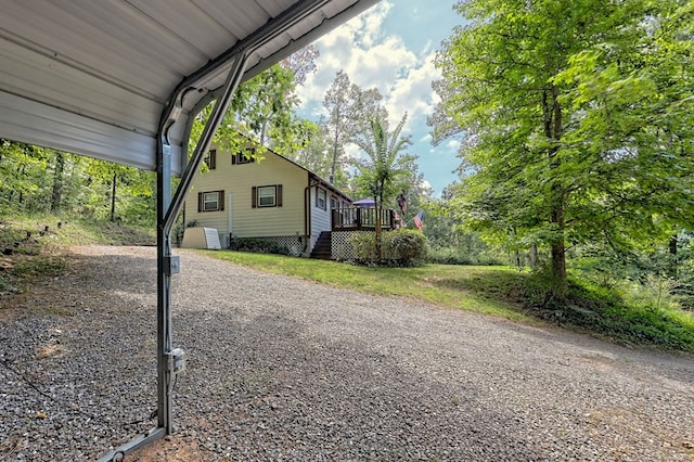 view of side of property featuring a wooden deck