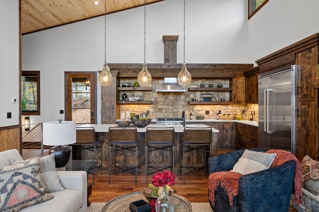 living area with wood ceiling, wood finished floors, and high vaulted ceiling