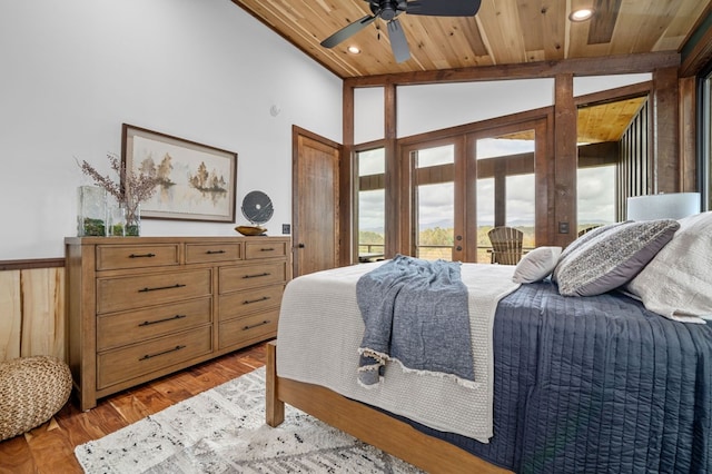 bedroom with access to exterior, vaulted ceiling, wood ceiling, wainscoting, and light wood-type flooring