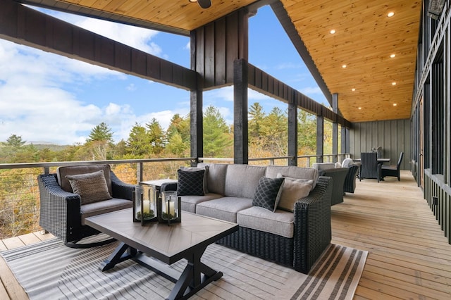 wooden terrace featuring an outdoor hangout area