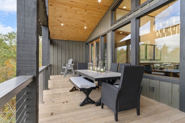 wooden terrace with outdoor dining area