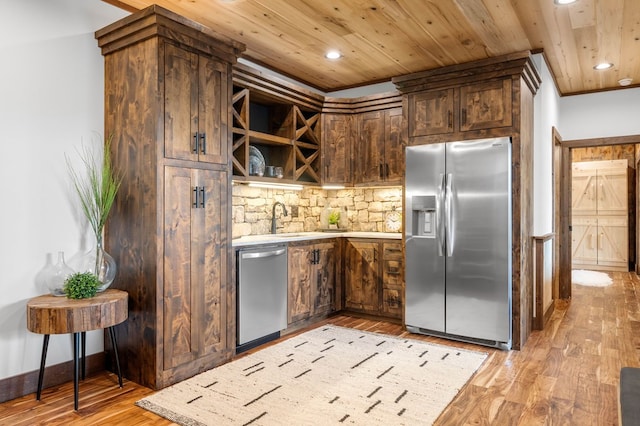 kitchen featuring wooden ceiling, stainless steel appliances, light wood-type flooring, and a sink