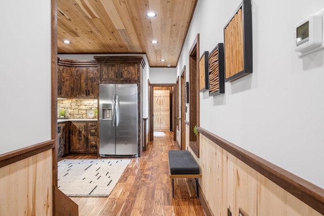 kitchen featuring wooden ceiling, recessed lighting, stainless steel fridge with ice dispenser, and light wood finished floors