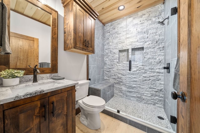 full bathroom featuring vanity, wood finished floors, a stall shower, wood ceiling, and toilet