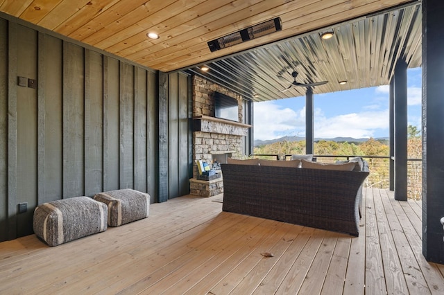 wooden deck with a mountain view