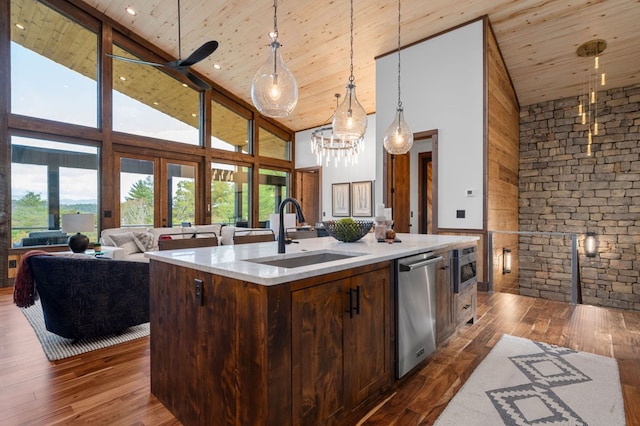 kitchen with dark wood-type flooring, open floor plan, wood ceiling, appliances with stainless steel finishes, and a sink