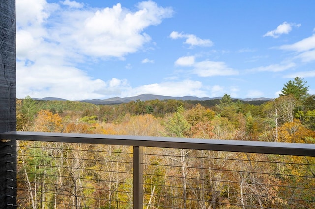 balcony with a mountain view and a forest view