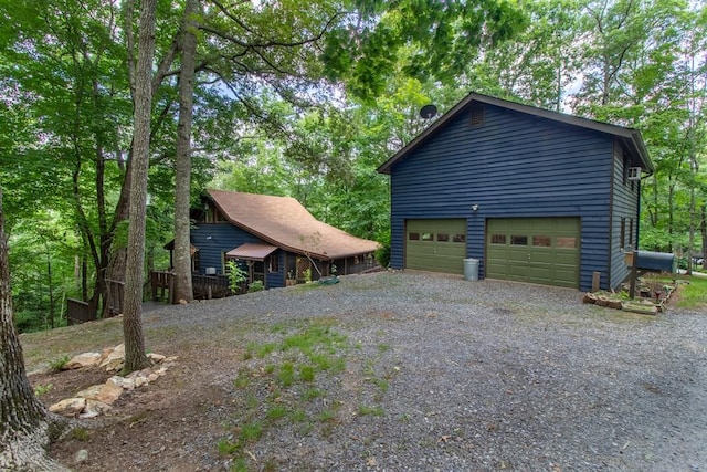 view of side of property featuring a garage