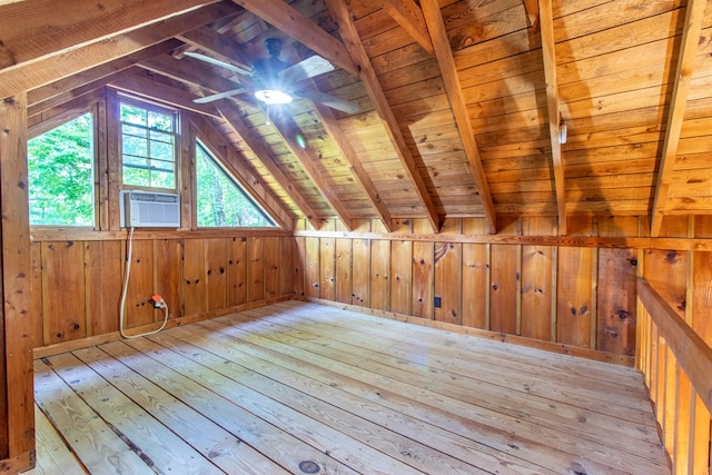 bonus room with vaulted ceiling with beams, wood ceiling, wooden walls, and light hardwood / wood-style floors