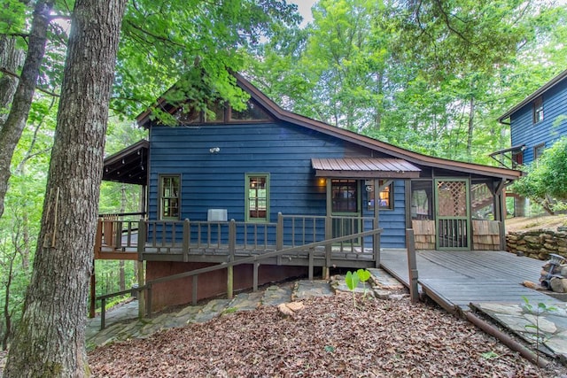 exterior space featuring a wooden deck