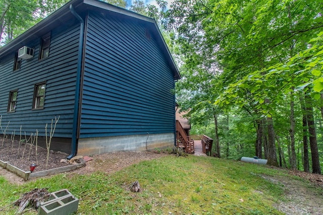 view of side of home featuring a lawn