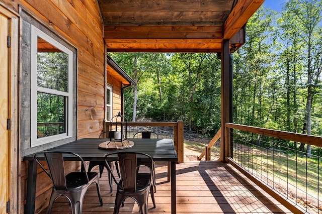 wooden deck with outdoor dining area