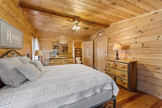 bedroom featuring vaulted ceiling with beams, wood-type flooring, wooden ceiling, and wooden walls