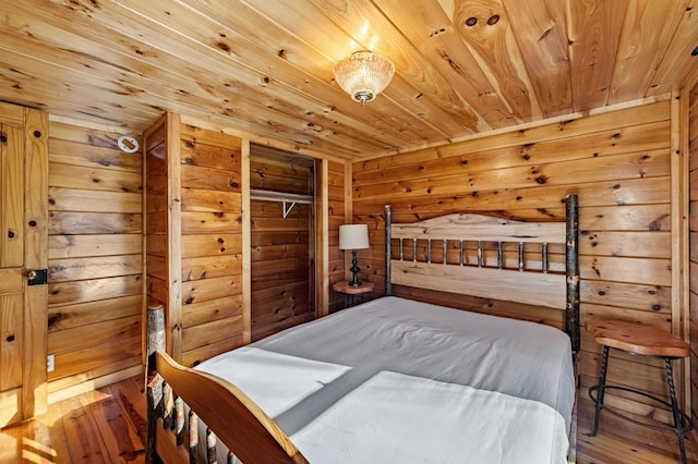 bedroom with wood walls, wood-type flooring, and wooden ceiling