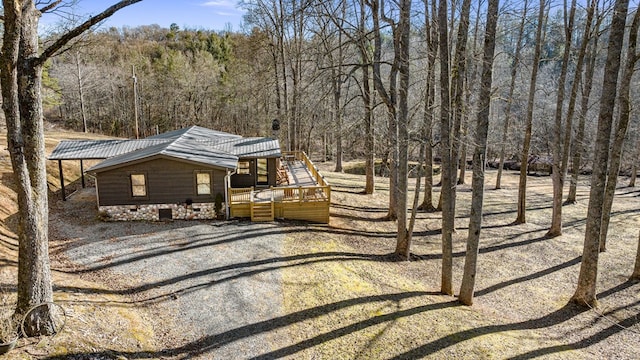 view of front of property featuring a wooden deck