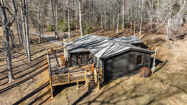 view of side of property with a wooden deck and central air condition unit