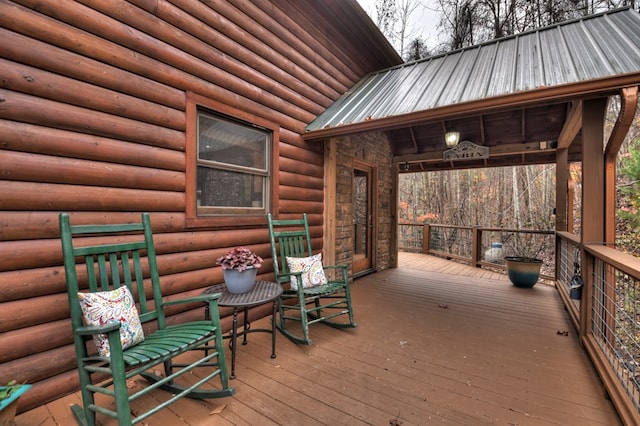 wooden deck featuring covered porch