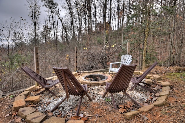 view of yard with an outdoor fire pit