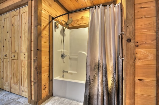 bathroom with shower / tub combo, wood ceiling, and wood walls